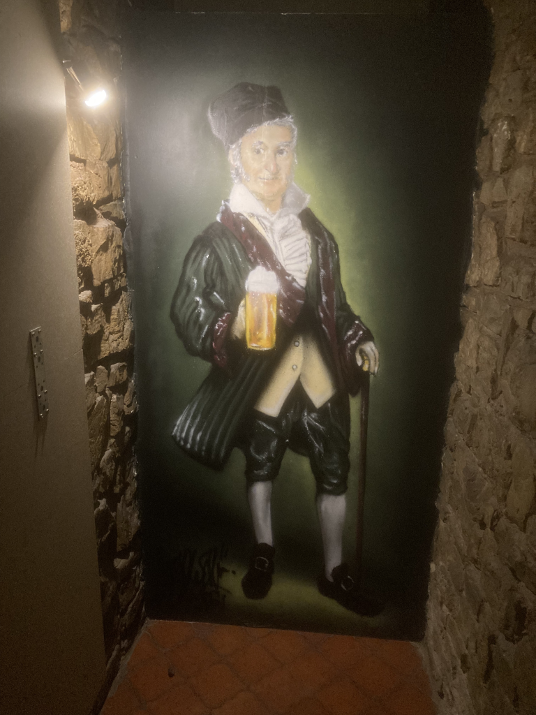 Det er et fedt maleri - desværre skal man lige rundt om et hjørne før man finder det.